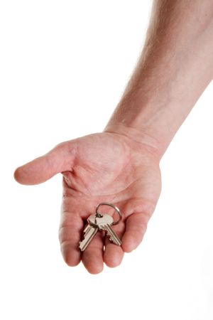 keys in hand on white backgroundの写真素材