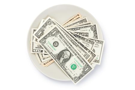 american currency on plate on white backgroundの写真素材