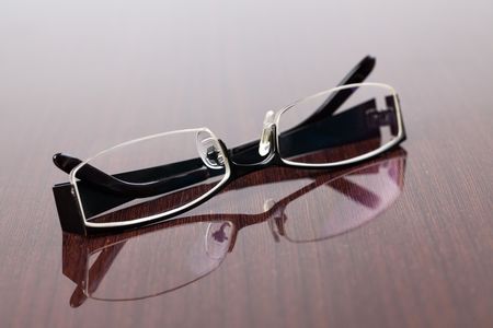 the glasses on wooden tableの写真素材