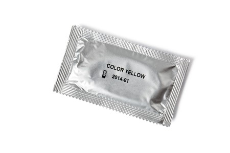 condom in the package on white backgroundの写真素材