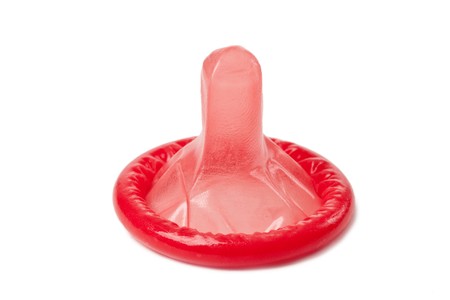 red condom on white backgroundの写真素材