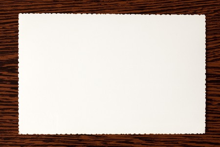 white old paper on wooden backgroundの写真素材