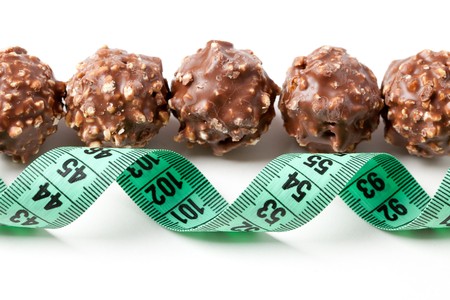 truffle and measuring tape on white backgroundの写真素材