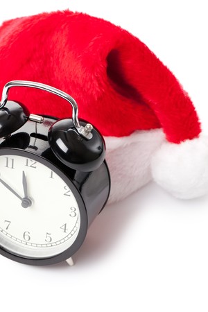 xmas red hat and alarm clock on white backgroundの写真素材