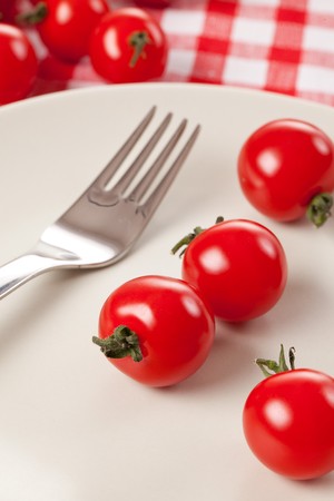cherry tomatoes on plateの写真素材