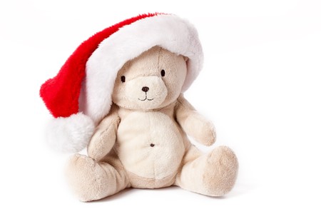 teddy bear and xmas cap on white backgroundの写真素材
