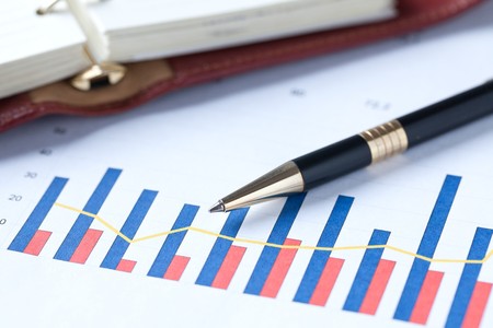 the financial graph with pen の写真素材