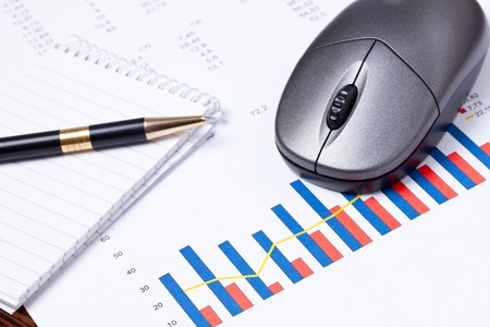 financial graph with computer mouseの写真素材