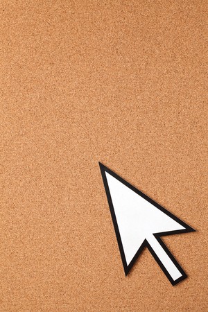 mouse cursor on corkboard backgroundの写真素材