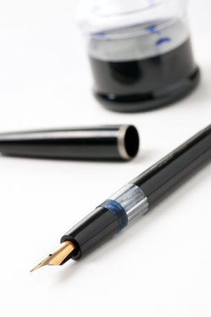 fountain pen and ink on white backgroundの写真素材