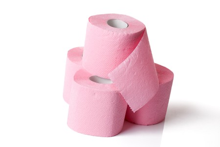 pink toilet paper on white backgroundの写真素材