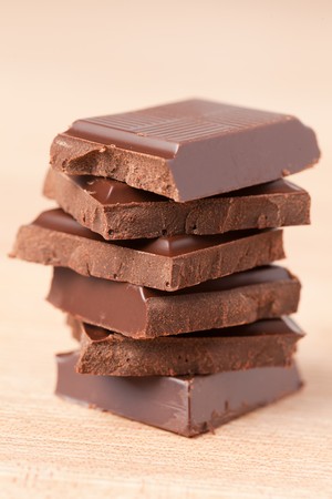 pile of chocolate on wooden table