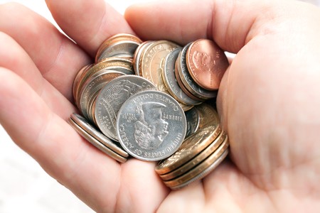 photo shot of coins in handの写真素材