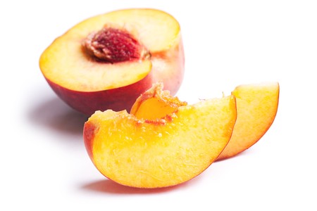 slices of peach on white backgroundの写真素材
