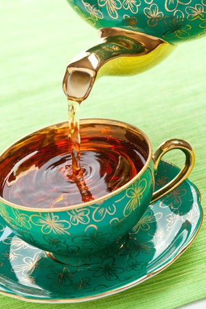 the tea in antique porcelain mugの写真素材