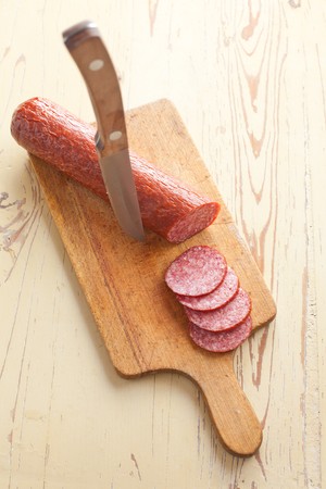 fresh salami on kitchen tableの写真素材