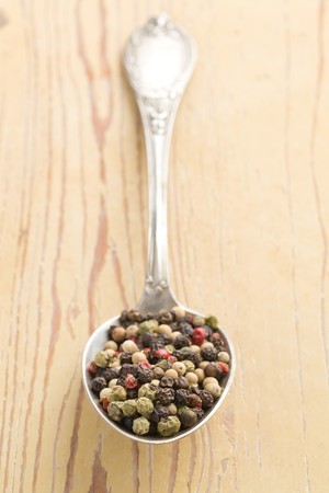 color pepper spice on silver spoonの写真素材