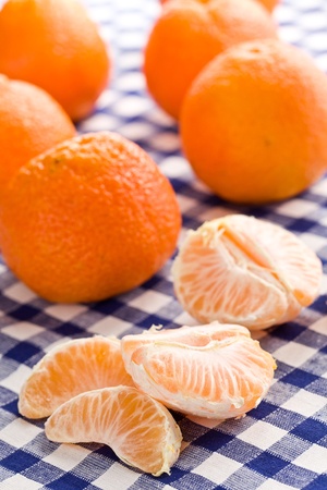 tangerines fruits  on picnic tableclothの写真素材