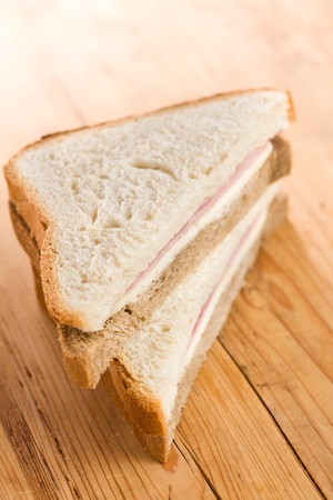 the ham sandwich on wooden table の写真素材
