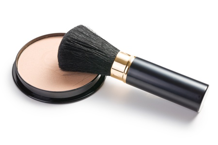 the makeup brush and cosmetic powder compact 