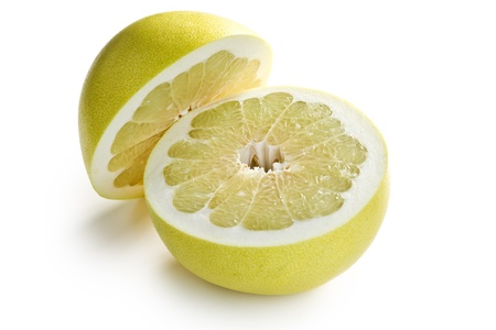 two halves of pomelo fruit on white backgroundの写真素材