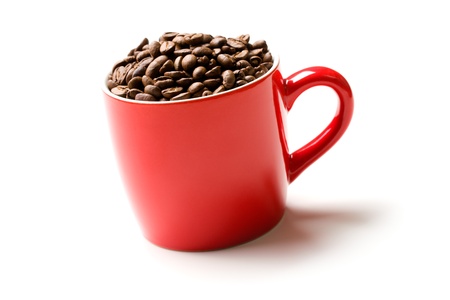 colorful mug with coffee beans on white backgroundの写真素材