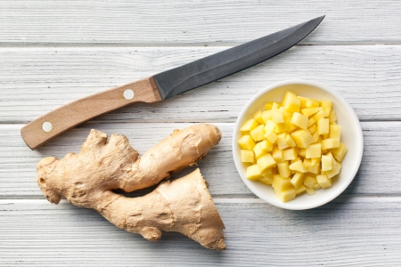 sliced ginger root on kitchen tableの写真素材