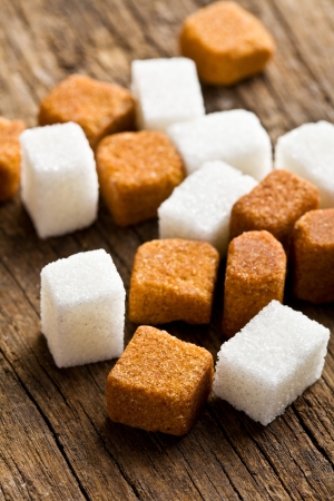 brown and white sugar cubes on wooden tableの写真素材