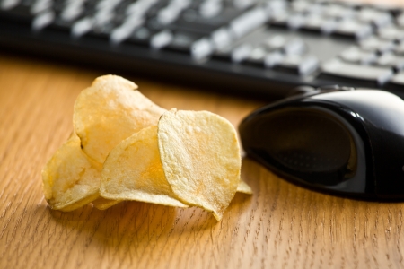 crispy potato chips on office tableの写真素材
