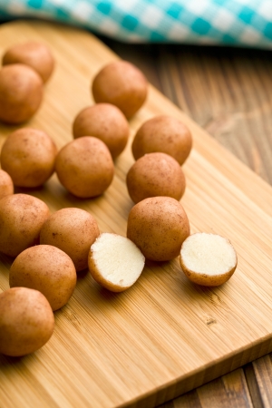 marzipan balls on chopping boardsの写真素材