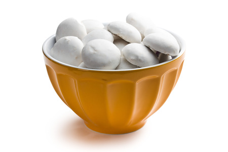 icing gingerbread in ceramic bowl on white の写真素材