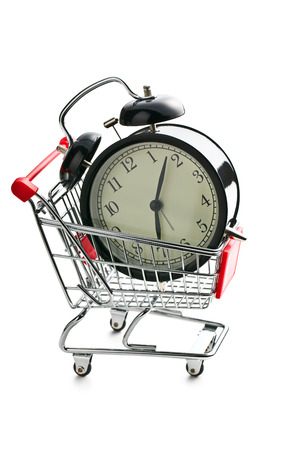 alarm clock in shopping cart on white backgroundの写真素材
