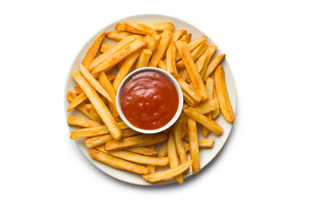 top view of french fries with ketchup on plate