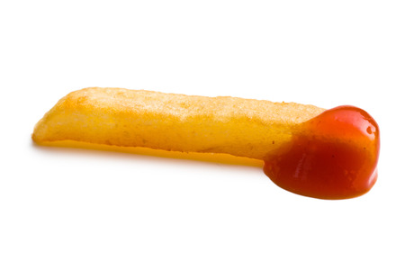 one piece of french fries with ketchup on white backgroundの写真素材