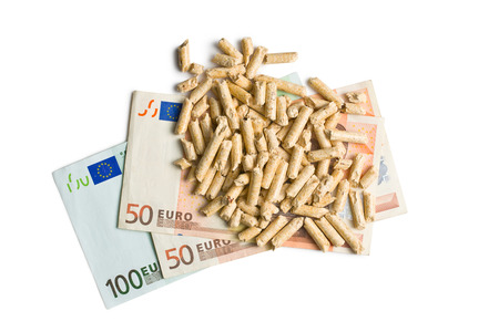 top view of pellets with euro bills on white backgroundの写真素材