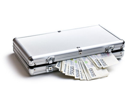 czech money in aluminium case on white backgroundの写真素材
