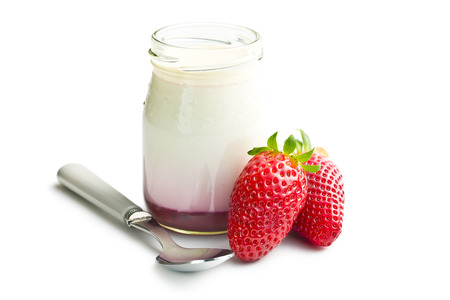 yogurt in jar with strawberries on white backgroundの写真素材