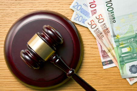 judge gavel and euro currency on wooden tableの写真素材
