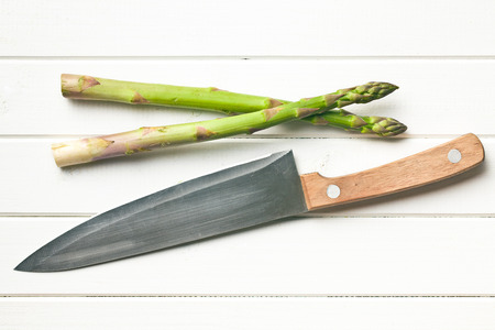 top view of green asparagus and knife