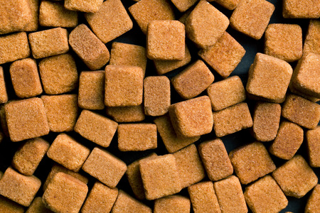 background made from brown sugar cubesの写真素材
