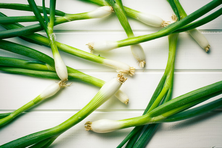 the spring onion on white tableの写真素材