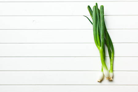 the spring onion on white tableの写真素材