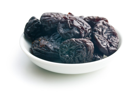 pitted prunes on white backgroundの写真素材