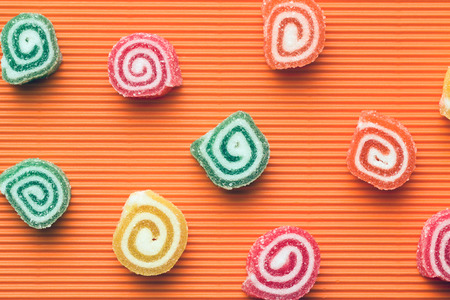 colorful candy on orange backgroundの写真素材