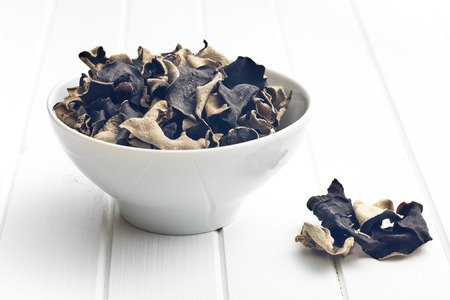 Dried chinese black fungus. Jelly ear in bowl.の写真素材