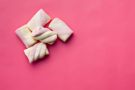 top view of sweet marshmallow on pink backgroundの写真素材