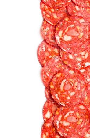 sliced chorizo salami on white backgroundの写真素材