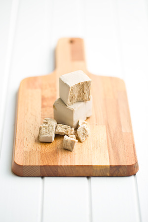 fresh yeast on cutting boardの写真素材