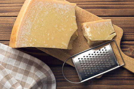 the cheese grater and parmesanの写真素材