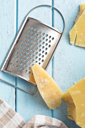 the cheese grater and parmesanの写真素材